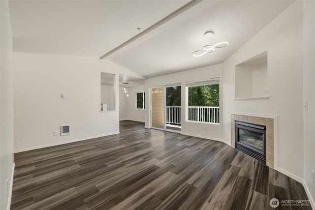 710 240th Way SE Unit J302, Sammamish, WA 98074 - unfurnished living room with dark wood finished floors, a tiled fireplace, and baseboards