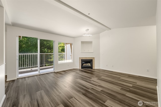 710 240th Way SE Unit J302, Sammamish, WA 98074 - unfurnished living room with dark wood-style flooring, a tile fireplace, and baseboards