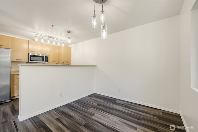 710 240th Way SE Unit J302, Sammamish, WA 98074 - kitchen featuring stainless steel appliances, dark wood-style floors, pendant lighting, and baseboards