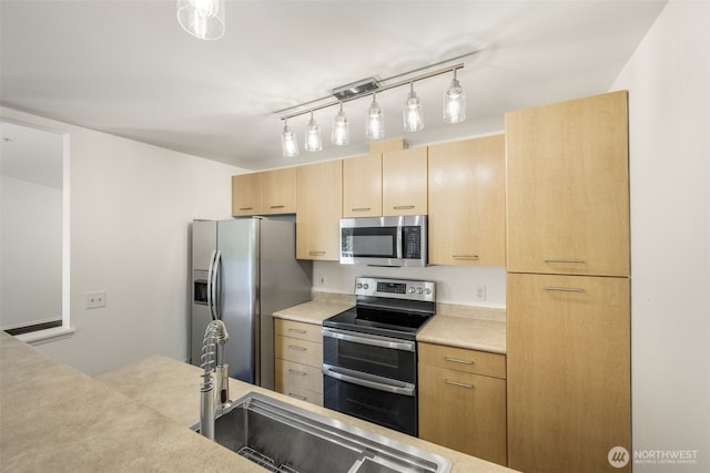 710 240th Way SE Unit J302, Sammamish, WA 98074 - kitchen featuring appliances with stainless steel finishes, light brown cabinets, light countertops, and a sink