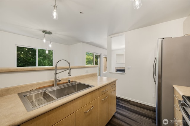 710 240th Way SE Unit J302, Sammamish, WA 98074 - kitchen featuring a sink, dark wood finished floors, freestanding refrigerator, hanging light fixtures, and light countertops