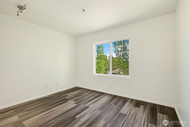 710 240th Way SE Unit J302, Sammamish, WA 98074 - unfurnished room with dark wood-style floors and baseboards