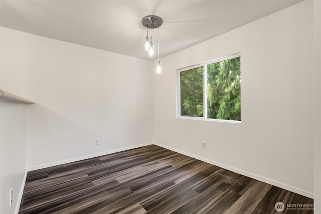 710 240th Way SE Unit J302, Sammamish, WA 98074 - spare room featuring dark wood-style floors and baseboards