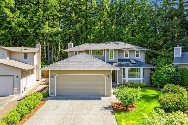 1826 168th Pl SE, Mill Creek, WA 98012 - traditional-style home with concrete driveway, an attached garage, a shingled roof, and a chimney