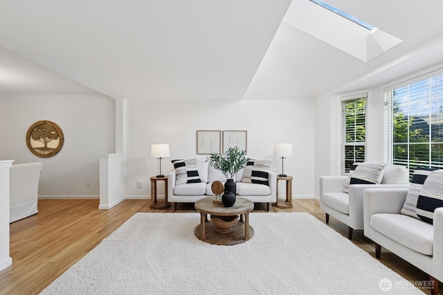 1826 168th Pl SE, Mill Creek, WA 98012 - living room featuring a skylight, light wood-style flooring, lofted ceiling, and baseboards