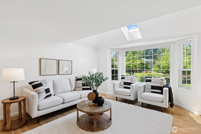 1826 168th Pl SE, Mill Creek, WA 98012 - living area with a skylight, wood finished floors, and baseboards