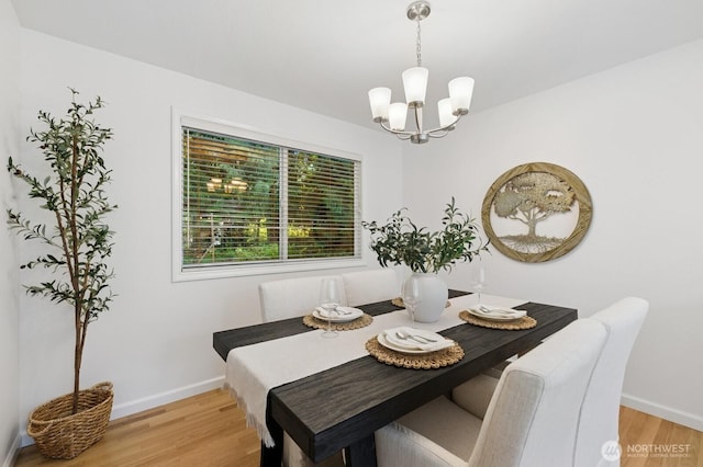 1826 168th Pl SE, Mill Creek, WA 98012 - dining space featuring a chandelier, light wood-style floors, and baseboards