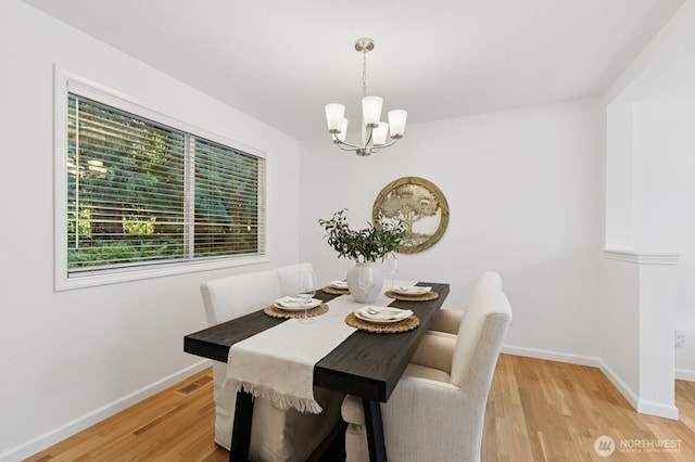1826 168th Pl SE, Mill Creek, WA 98012 - dining room with a chandelier, light wood-type flooring, and baseboards