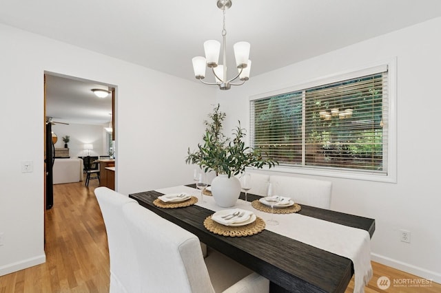1826 168th Pl SE, Mill Creek, WA 98012 - dining room with a chandelier, light wood finished floors, and baseboards