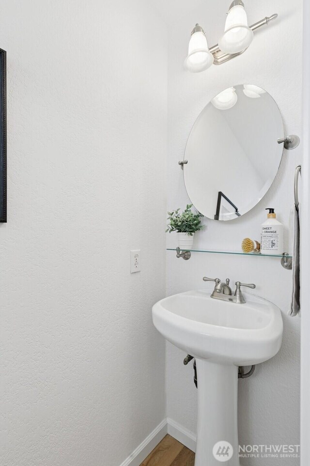 1826 168th Pl SE, Mill Creek, WA 98012 - bathroom with baseboards, wood finished floors, and a sink