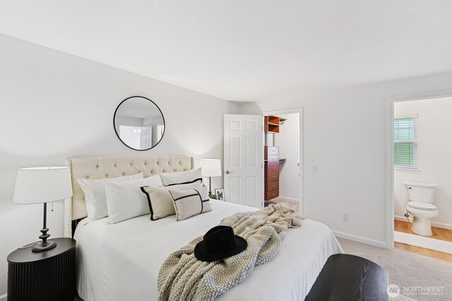1826 168th Pl SE, Mill Creek, WA 98012 - carpeted bedroom with baseboards, a spacious closet, and ensuite bath