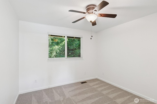 1826 168th Pl SE, Mill Creek, WA 98012 - spare room with baseboards, light carpet, and a ceiling fan