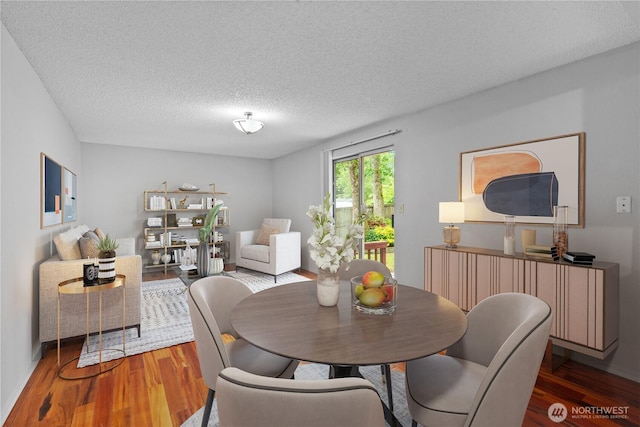 18802 10th Avenue Ct E, Tacoma, WA 98387 - dining space with wood finished floors and a textured ceiling