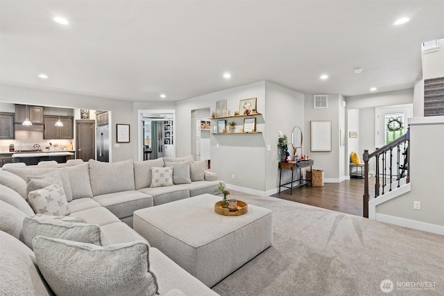 17421 128th Avenue Ct E, Puyallup, WA 98374 - living area featuring dark carpet, stairway, recessed lighting, and baseboards