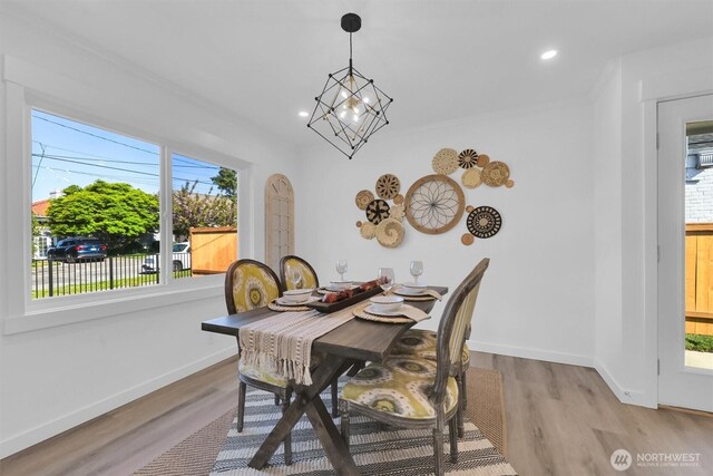 8042 19th Ave NW, Seattle, WA 98117 - dining space with plenty of natural light, light wood-type flooring, baseboards, recessed lighting, and arched walkways