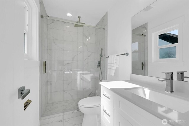 8042 19th Ave NW, Seattle, WA 98117 - full bath featuring marble finish floors, vanity, a marble finish shower, toilet, and recessed lighting