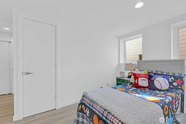 8042 19th Ave NW, Seattle, WA 98117 - bedroom with wood finished floors, recessed lighting, and baseboards