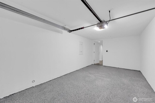 8042 19th Ave NW, Seattle, WA 98117 - garage with a garage door opener and electric panel
