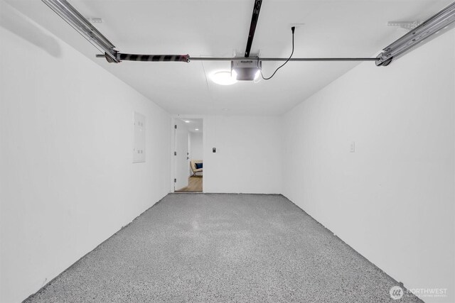 8042 19th Ave NW, Seattle, WA 98117 - garage featuring a garage door opener