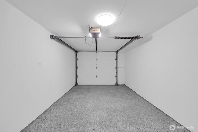 8042 19th Ave NW, Seattle, WA 98117 - garage featuring a garage door opener
