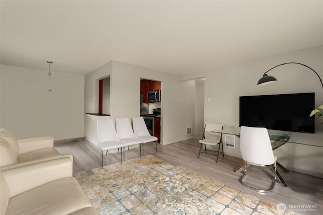 512 141st Ave SE Unit 55, Bellevue, WA 98007 - living room featuring light wood-style floors and baseboards