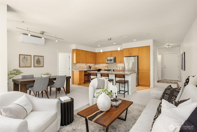 145 Ferncliff Ave NE Unit D338, Bainbridge Island, WA 98110 - living room with a wall unit AC and rail lighting