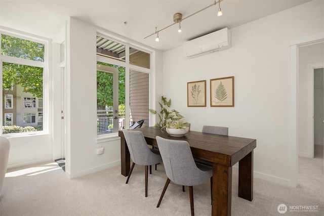 145 Ferncliff Ave NE Unit D338, Bainbridge Island, WA 98110 - dining space featuring a wall mounted AC, healthy amount of natural light, and light colored carpet