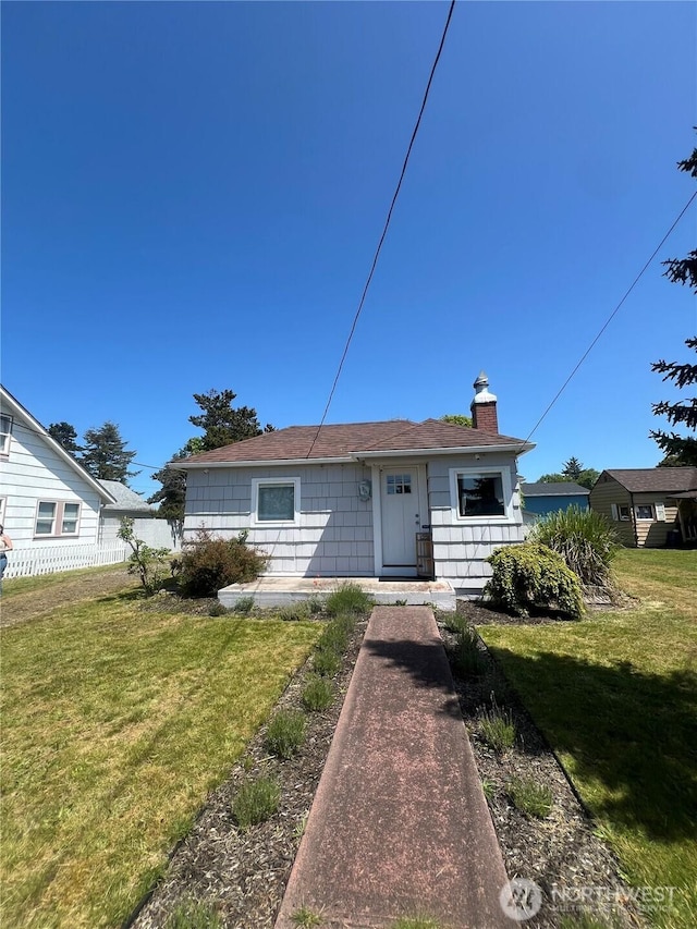 908 Washington Ave N, Long Beach, WA 98631 - bungalow with a chimney and roof with shingles