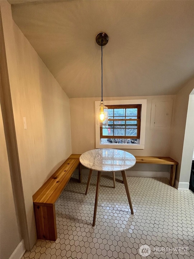 908 Washington Ave N, Long Beach, WA 98631 - dining space featuring vaulted ceiling and baseboards