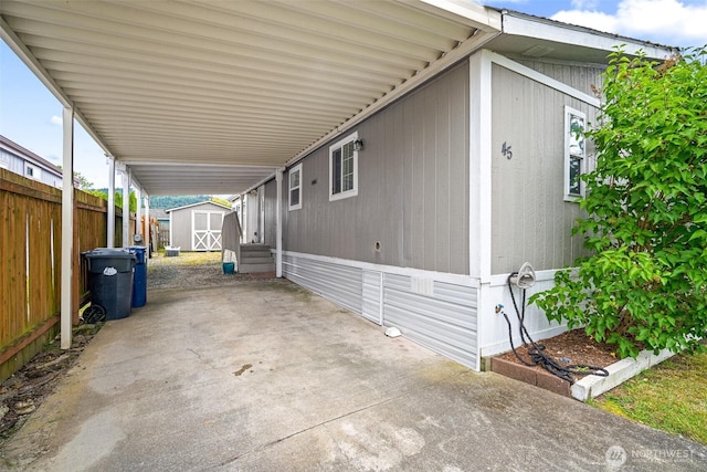 1120 S 25th St Unit 45, Mount Vernon, WA 98274 - view of patio featuring a shed and an attached carport