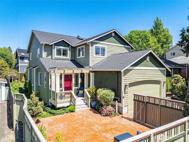 3534 SW Monroe St, Seattle, WA 98126 - view of front of house with a shingled roof and an attached garage