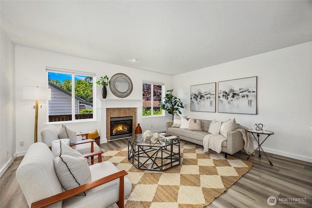 3534 SW Monroe St, Seattle, WA 98126 - living area with wood finished floors, baseboards, and a tile fireplace