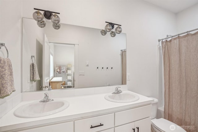 201 SE Alder St, Winlock, WA 98596 - bathroom featuring double vanity, shower / bath combo, and toilet