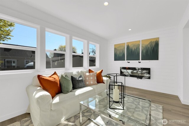 8040 19th Ave NW, Seattle, WA 98117 - living room featuring healthy amount of natural light, wood finished floors, recessed lighting, and baseboards