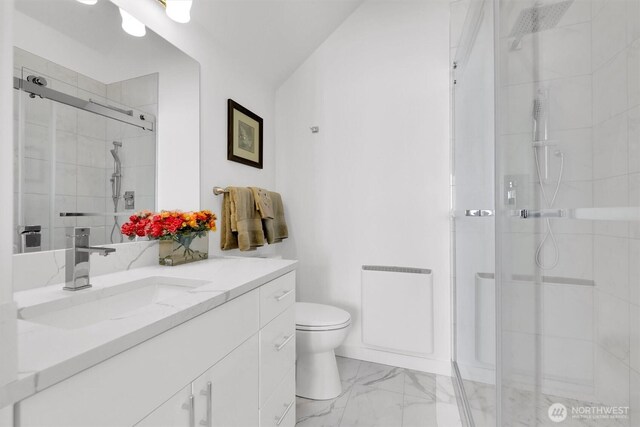 8040 19th Ave NW, Seattle, WA 98117 - full bath featuring vanity, marble look tiles, a shower stall, and toilet