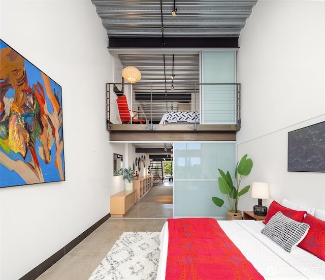 1310 E Union St Unit 401, Seattle, WA 98122 - bedroom featuring baseboards and concrete floors