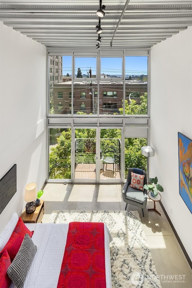 1310 E Union St Unit 401, Seattle, WA 98122 - bedroom with multiple windows and a wall of windows