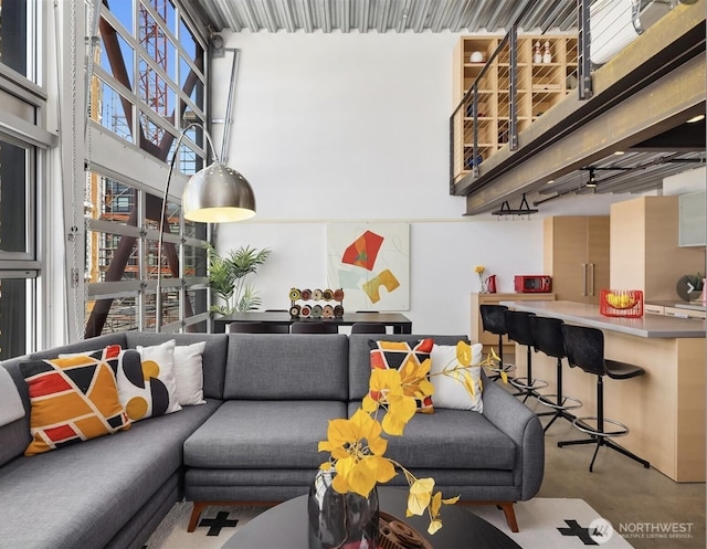 1310 E Union St Unit 401, Seattle, WA 98122 - living area with a towering ceiling and concrete floors