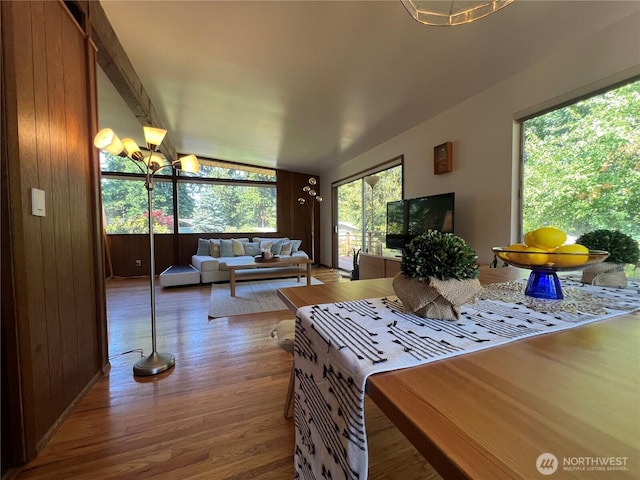 12509 SE 48th Pl, Bellevue, WA 98006 - living area with wood finished floors, lofted ceiling, and a chandelier
