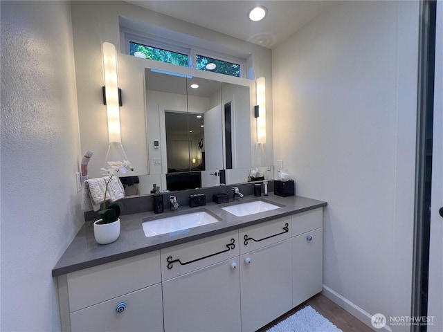 12509 SE 48th Pl, Bellevue, WA 98006 - bathroom featuring double vanity and baseboards