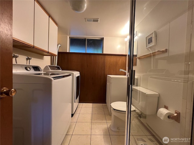 12509 SE 48th Pl, Bellevue, WA 98006 - full bath with washing machine and dryer, toilet, a stall shower, tile patterned flooring, and wainscoting