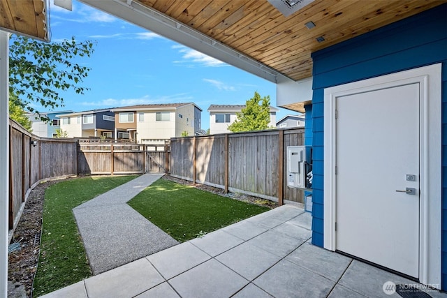 684 SW 100th St, Seattle, WA 98106 - fenced backyard with a patio and a residential view