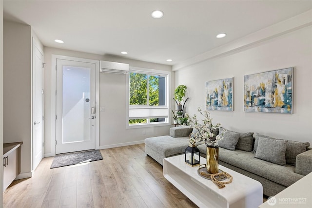 684 SW 100th St, Seattle, WA 98106 - living room featuring an AC wall unit, light wood finished floors, recessed lighting, and baseboards