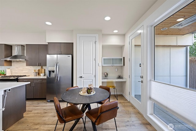684 SW 100th St, Seattle, WA 98106 - dining space with light wood-type flooring, recessed lighting, and french doors