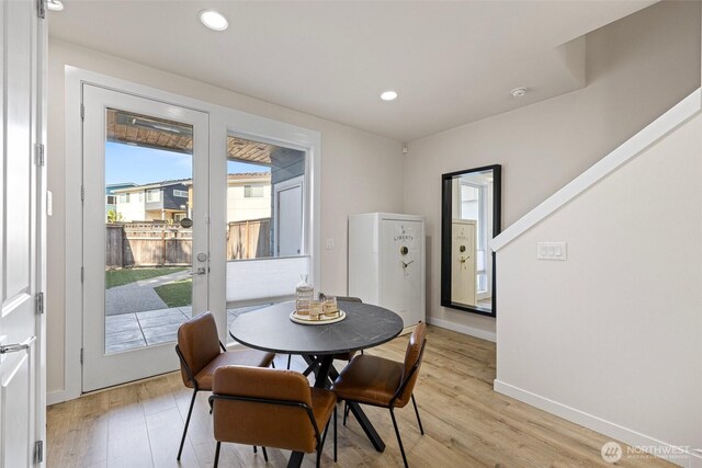 684 SW 100th St, Seattle, WA 98106 - dining area featuring light wood-type flooring, baseboards, and recessed lighting