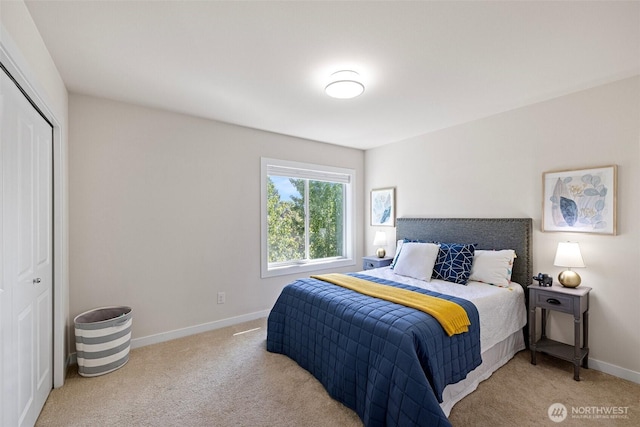 684 SW 100th St, Seattle, WA 98106 - bedroom with light colored carpet, a closet, and baseboards
