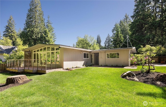 639 130th Ave NE, Bellevue, WA 98005 - back of property featuring a wooden deck and a yard