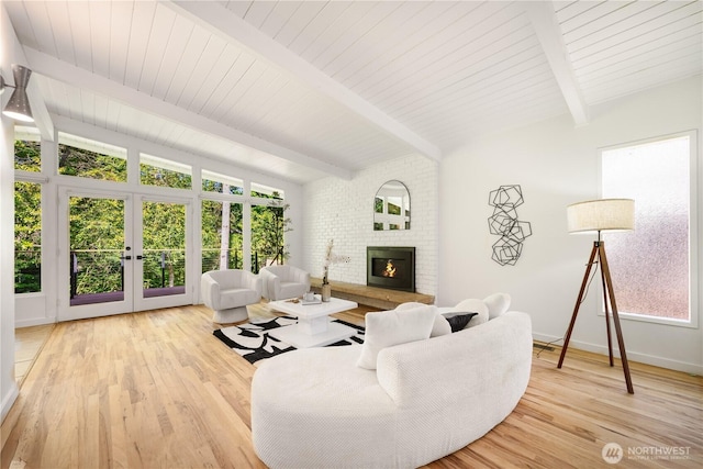 639 130th Ave NE, Bellevue, WA 98005 - living area featuring french doors, light wood-style floors, a fireplace, and baseboards