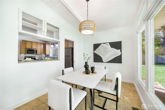 639 130th Ave NE, Bellevue, WA 98005 - dining area featuring light tile patterned floors, healthy amount of natural light, baseboards, and wood ceiling