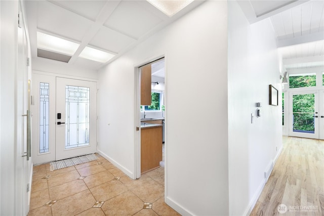 639 130th Ave NE, Bellevue, WA 98005 - entryway with beam ceiling, baseboards, and light tile patterned floors